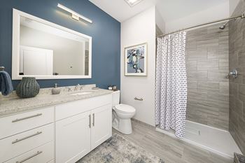 Bathroom with large mirror